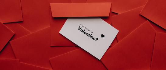 Will You Be My Valentine? invitation on red background